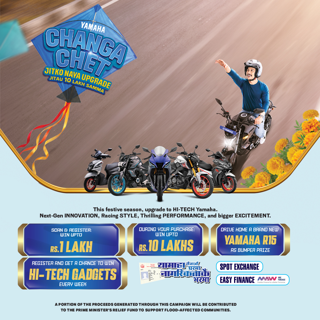 A helmeted Yamaha rider raises one arm above a lineup of motorcycles beneath the Changa Chet campaign kite and prize offers.
